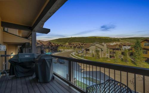 a balcony with a view of a street and houses at Black Rock Ridge 14457 by Moose Management in Kamas
