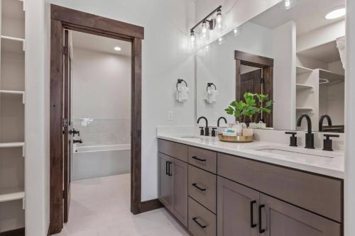 a bathroom with a double sink and a tub at Black Rock Ridge 14488 by Moose Management in Park City