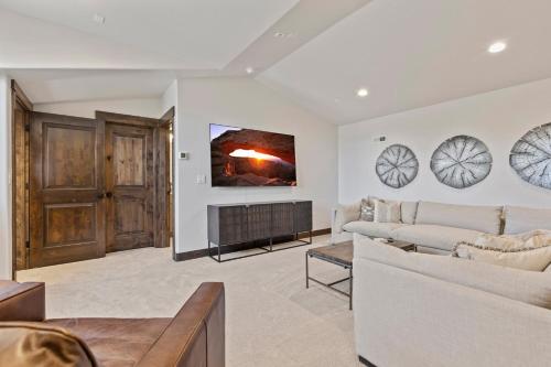 a living room with a couch and a fire place at Black Rock Ridge 14488 by Moose Management in Park City