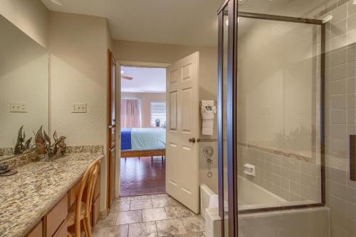 a bathroom with a shower and a walk in shower at River Zen CW C207 in New Braunfels