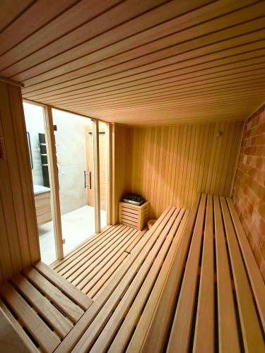a sauna with a wooden floor in a room at Apartman Filipović, Vila Dunav in Zlatibor
