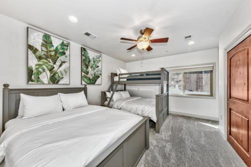 a bedroom with two beds and a ceiling fan at Tahoe Woods 501 - Location Spacious Walk to Beach in South Lake Tahoe