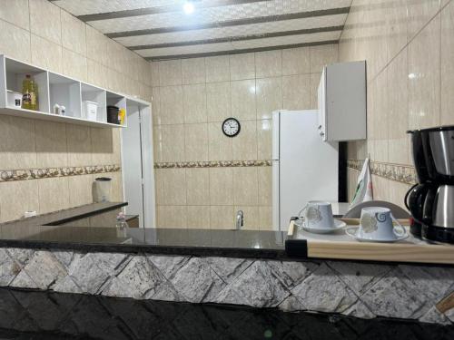 Una cocina o zona de cocina en hospedagemsaopedro apartamento 2