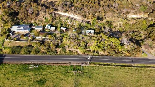an aerial view of a road on a mountain at Eastern Reef Cottages in Port Campbell