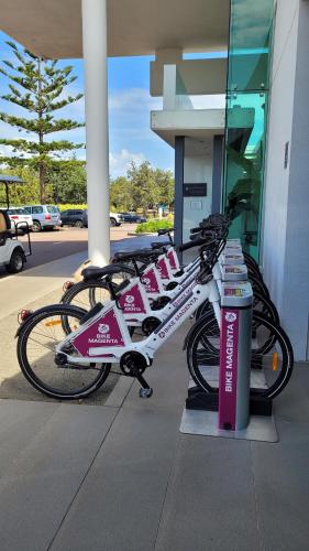 two bikes parked in front of a building at Pullman Magenta Shores Resort in The Entrance