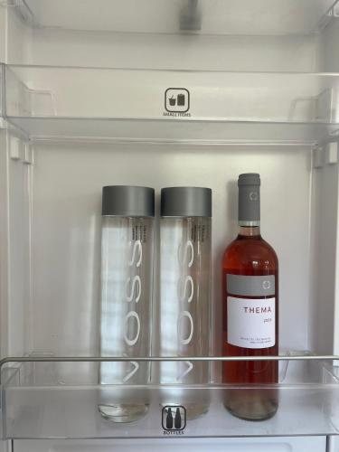 a bottle of wine sitting in a refrigerator at Villa Thalia in Kavala