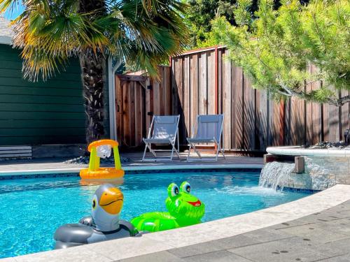 a swimming pool with a toy in the middle of it at Redwood Oasis, Grove and Nook in Felton