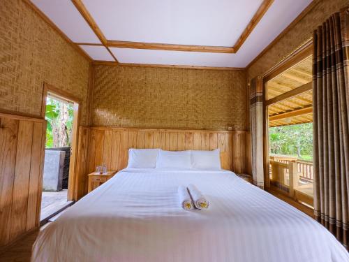 Postel nebo postele na pokoji v ubytování Mulia Garden Bungalows - Monthly Rate Available