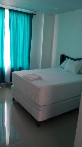 Postel nebo postele na pokoji v ubytování Hotel Mendoza Inn