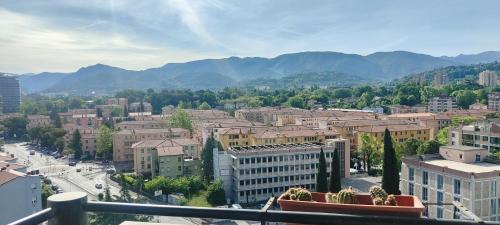a view of a city with mountains in the background at Aurora appartamento, intero appartamento di 105 mq in Terni