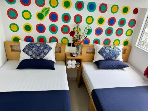 Letto o letti in una camera di Manila Lounge