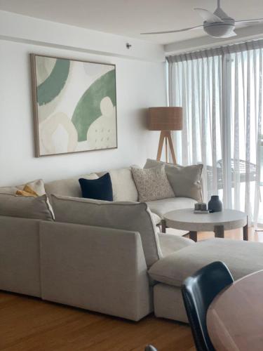 a living room with a couch and a table at Cilento Mooloolaba in Mooloolaba
