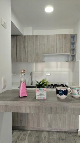 a kitchen with a counter with a pink bottle on it at Horeb Paradise in La Tebaida