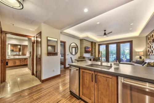 an open kitchen with a sink and a living room at Zalanta 222 – Luxe Stay by Gondola Lake in Stateline