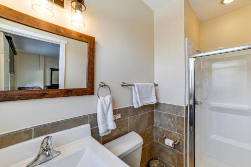 a bathroom with a sink and a mirror at Massive Roscoe Retreat Great for Large Groups! in Roscoe