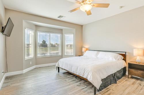 a bedroom with a bed and a ceiling fan at Coldwater Golf Course Getaway in Avondale! in Avondale
