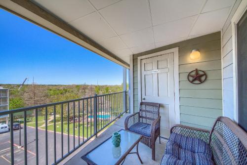 a balcony with two chairs and a table with a view at Riverpalooza RRC A305 in New Braunfels