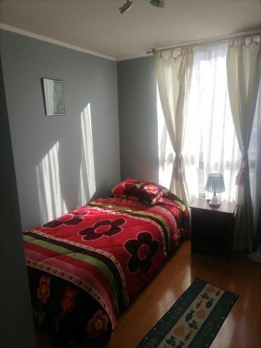 Кровать или кровати в номере Santiago Lord Apartment