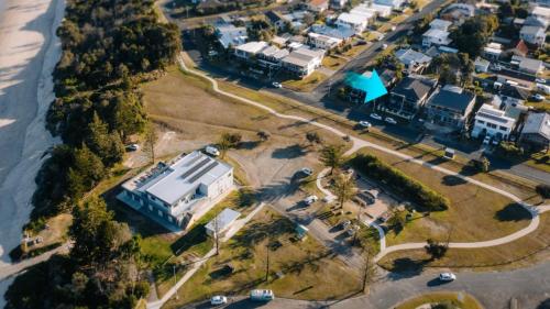 an aerial view of a house next to the water at Sea Breeze in Old Bar