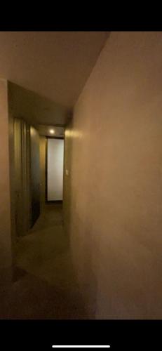 an empty hallway with a white door in a room at 4 bhk lavish lake side property in Lavasa