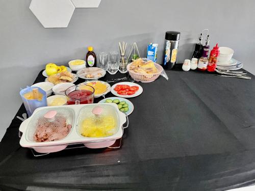 a table with a bunch of food on it at SapzRes at Klerksdorp in Klerksdorp
