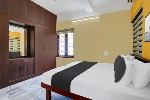 Postel nebo postele na pokoji v ubytování Hotel O LM RESIDENCY