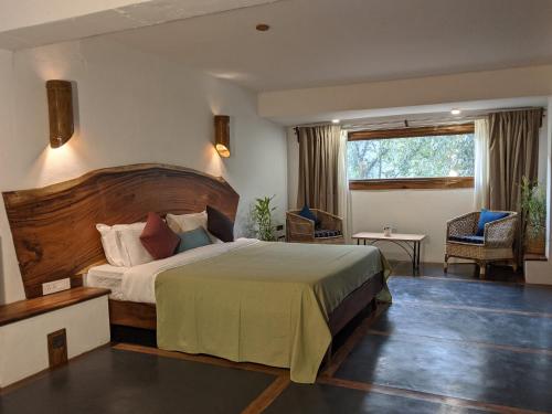 Ένα ή περισσότερα κρεβάτια σε δωμάτιο στο Kengbari Retreat