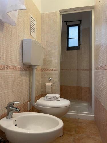 a bathroom with a toilet and a sink at Aria di sale in Trapani