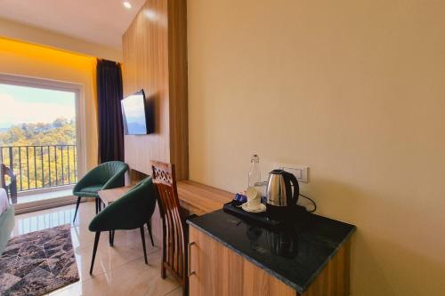 Μια τηλεόραση ή/και κέντρο ψυχαγωγίας στο Hotel Pines & Peaks Dalhousie
