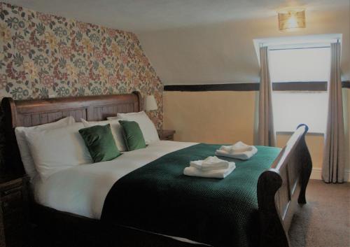 Postel nebo postele na pokoji v ubytování Star Inn Hotel
