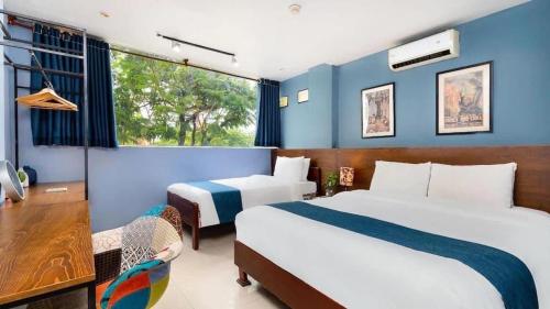 Postelja oz. postelje v sobi nastanitve Hoàng Phi Hotel