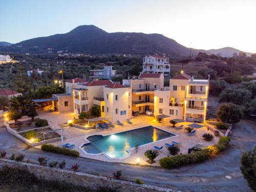 an aerial view of a large house with a swimming pool at Apartments Hotel & Studios, Xifoupolis in Monemvasia