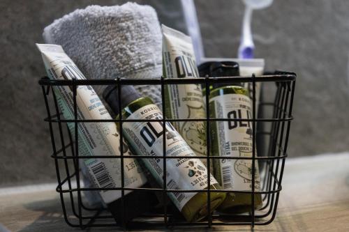 a basket filled with toothbrushes and toothpaste at Aegeans Eye in Azolimnos