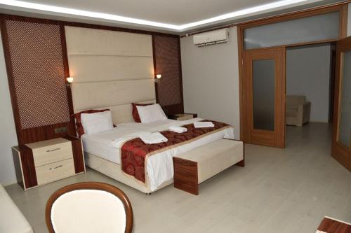 Katil atau katil-katil dalam bilik di Cevaher Hotel & Suıtes