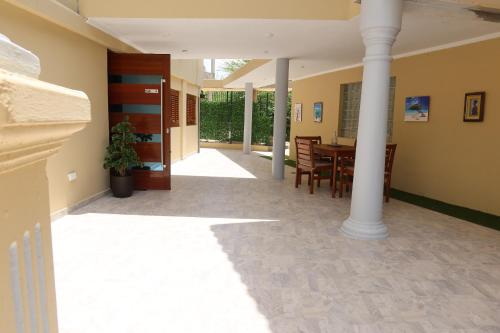 a hallway of a house with a table and chairs at Piscadera bay resort 15c in Willemstad