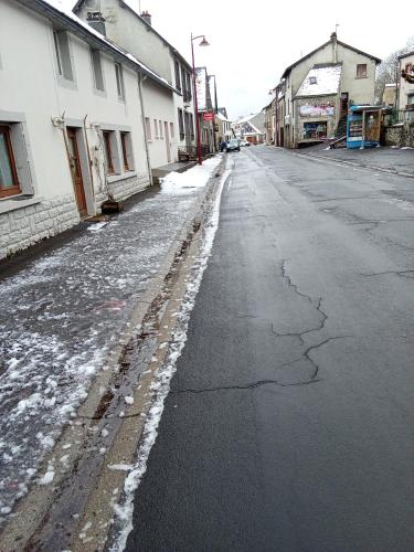 an empty street with snow on the ground at Picherande in Picherande