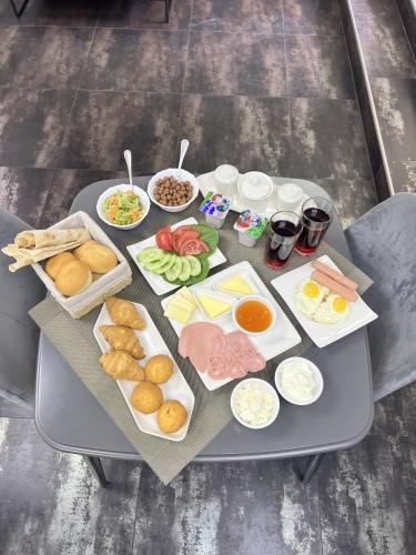 a table with many different types of food on it at Mashtots Hotel in Yerevan
