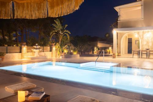 a swimming pool at night in a villa at Porta Verde Luxury Residence, By TK Property Management in Laganas