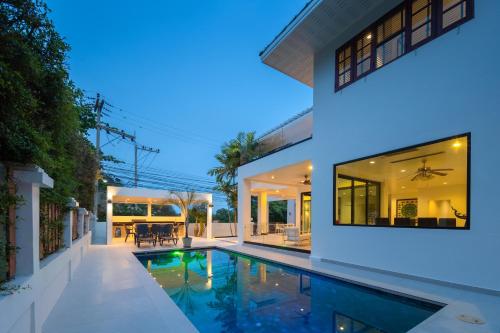 an image of a house with a swimming pool at Stunning villa with pool and tropical garden in Hua Hin