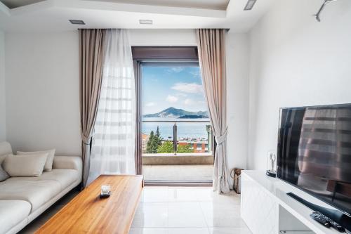 TV a/nebo společenská místnost v ubytování Przno Apartments by In Property