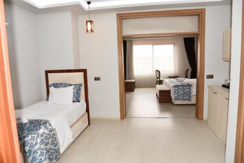 Katil atau katil-katil dalam bilik di Cevaher Hotel & Suıtes