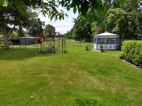 a park with a playground and a gazebo at B&B Dream On Wheels in Lommel