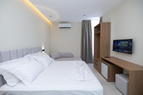 Postel nebo postele na pokoji v ubytování Hotel Aluor