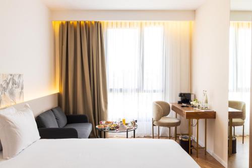 Postel nebo postele na pokoji v ubytování DIAGONAL HOTEL