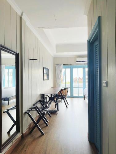 a dining room with a table and chairs at Wiengket Heritage 1964 in Bangkok