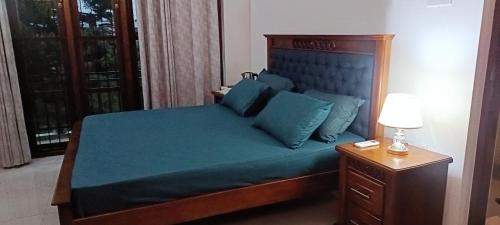 Ένα ή περισσότερα κρεβάτια σε δωμάτιο στο Sweet Home Ja-Ela