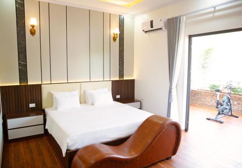 Voodi või voodid majutusasutuse GRAD Khách Sạn Sơn Lâm toas
