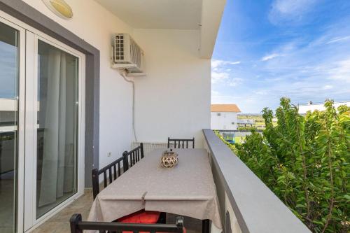 a table on the balcony of a building at Perinic, No 2 in Vrsi