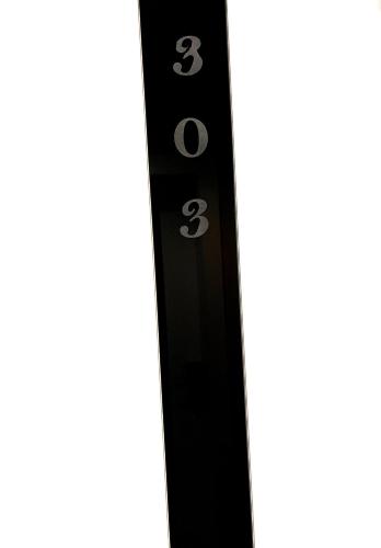 a black remote control on a white background at Hotel Aluor in Vlorë