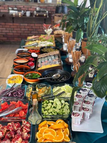 a buffet of food on a long table at Boutique Hotel Baku in Baku